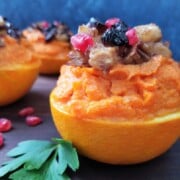 Sweet Potato Stuffed Orange Cups Topped with Caramelized Pears, Pecans & Cranberries | giveitsomethyme.com