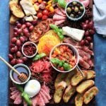 Ultimate Heirloom Tomato Bruschetta Cheese Board | Give it Some Thyme – a delicious snacking display of heirloom tomato bruschetta with an assortment of Italian cheeses, charcuterie, toasted baguette and more! #heirloomtomatobruschetta #heirloomtomatobruschettarecipe #tomatobruschetta #cheeseandcharcuterieboard #cheeseandcharcuterieboarddisplay #cheeseandcharcuterieboardideas #cheeseandcharcuterieboardhowtomake #giveitsomethyme #bestappetizers #bestappetizersever #bestappetizersforparties