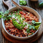 Slow Cooker Taco Chicken Chili Close Up | Give it Some Thyme – an easy crockpot recipe of tender shredded chicken bathing in the Mexican-spiced sauce is so hearty and delicious. Set it and forget it! #chilirecipe #slowcookerrecipe #crockpotrecipe #chickenchilirecipe #easychickenchilirecipe #tacochickenchili #healthychilirecipe #healthychickenchili #healthyfalldinners #gamedayrecipe #crockpotchicken #glutenfreerecipes #giveitsomethyme