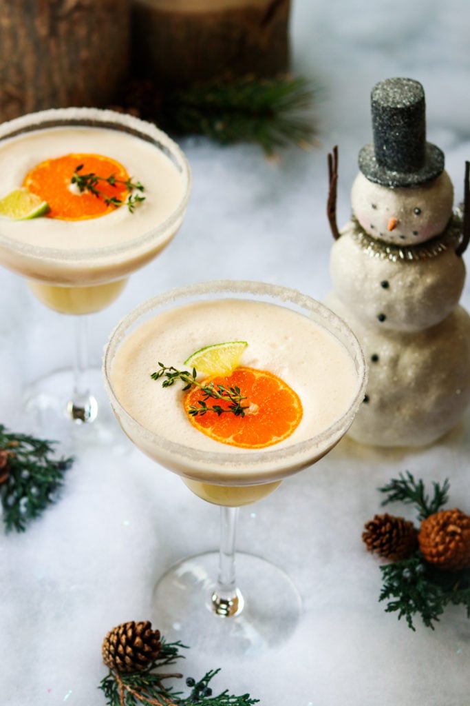 Frosty Citrus Margaritas - giveitsomethyme.com – a grown up blend of tequila, Grand Marnier, orange and lime juice, coconut milk and ice. A perfect holiday cocktail! #frostymargaritas #citrusmargarita #citrusmargaritarecipe #margaritas #margaritasrecipes #margaritasforacrowd #margaritasandmistletoeparty #christmascocktails #christmascocktailsrecipes #dairyfreecocktails #dairyfreecocktailscoconutmilk #giveitsomethyme