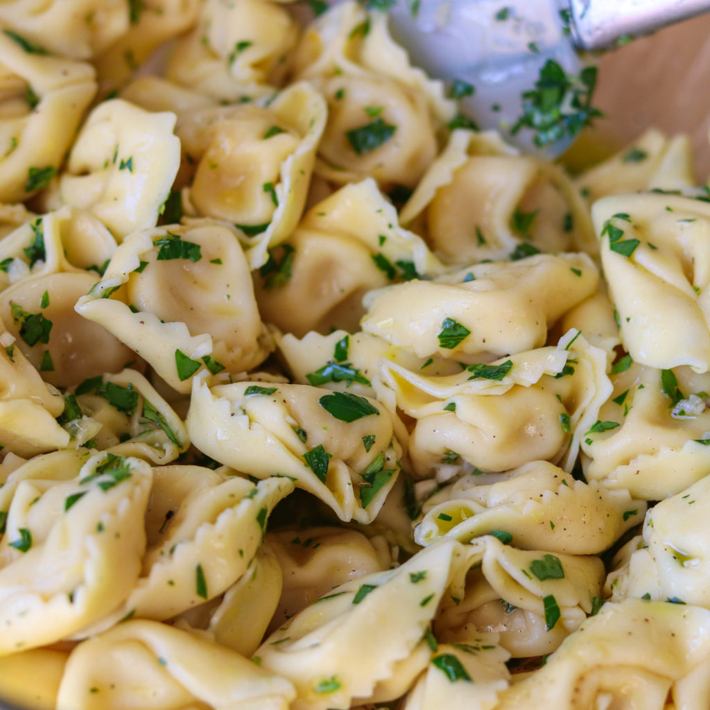 Cooked Tortellini Mixed in Dressing