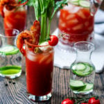 Bloody Mary w/ Cucumber-Lime Vodka | Give it Some Thyme - add cool, citrusy flavor with cucumber-lime infused vodka in this heavily garnished Bloody Mary. A cocktail and appetizer all in one! #bloodymary #bloodymaryrecipe #bloodymarybar #bloodymarybarideas #bloodymarymix #bloodymaryeasy #cucumberlimebloodymary #cucumberlimevodka #cucumberlimevodkadrinks #cocktails #cocktailswithvodka #giveitsomethyme