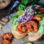 Seared Shrimp Po’ Boys w/ Creole Slaw - Give it Some Thyme – a delicious, quick and easy healthier twist on this creole classic! #shrimppoboy #shrimppoboysandwich #shirmppo’boyrecipe #easyshrimppoboy #shrimppoboyneworleans #searedshrimppoboys #po’boysandwich #po’boyrecipes #mardigrasfood #mardigrasfooddinners #mardigrasfoodeasy #fattuesday #fattuesdayfood #fattuesdayrecipes #giveitsomethyme