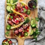 Spicy Glazed Lamb Tacos w/ Mediterranean Salsa – tender lamb loin coated in a sweet n’ spicy orange marmalade glaze, grilled to perfection, and topped with a refreshing tomato-cucumber salsa! #tacos #lambtacos #lambloinrecipes #greekrecipes #quickandeasydinners #healthydinners #ketorecipes #summerrecipes #giveitsomethyme | giveitsomethyme.com