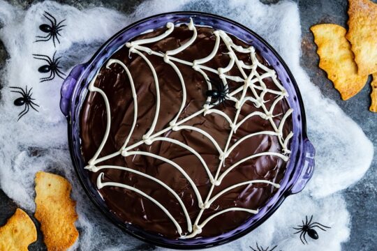 Spooky Chocolate-Glazed Cannoli Dip - Kids of all ages will love this easy Dark Chocolate Glazed Cannoli Dip loaded with mini chocolate chips! Make it ahead for an easy and irresistible Halloween treat! #cannolidip #bestcannolidip #halloweendesserts #halloweentreats #makeaheaddesserts #dessertsforparties #giveitsomethyme | giveitsomethyme.com