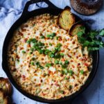 Hot Cheesy Crab Dip – this crazy delish appetizer is loaded with lump crabmeat, three cheeses and ready in 30 minutes. Perfect for game days and entertaining! #crabdip #crabrecipes #hotcrabdip #hotcrabdipeasy #crabdiphotappetizers #partyappetizers #quickandeasyappetizers #gamedayfood #skilletrecipes #giveitsomethyme | giveitsomethyme.com