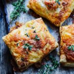 Bangers and Sweet Potato Mash Hand Pies - zesty sausage, creamy mashed sweet potatoes and Irish cheddar swaddled in golden, flaky puff pastry! #bangersandsweetpotatomash #handpies #bangersandmash #bangersandmashappetizer #bangersandmashhandpies #handpiessavory #stpatricksdayfood #stpaddysdayfood #giveitsomethyme | giveitsomethyme.com