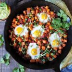 Sweet Potato Hash with Baked Eggs & Avocado Cilantro Crema | Give it Some Thyme - breakfast, lunch, or dinner, this gluten-free, one-skillet recipe is a hearty, delicious meal anytime of day!