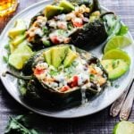 Southwest Chicken Stuffed Poblanos | giveitsomethyme.com - easy, gluten-free stuffed peppers packed with tender chicken, rice, beans and corn, oozing with cheese, and full of bold, delicious flavor. Perfect any night of the week!