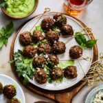 Greek Lamb Meatballs with Creamy Green Herb Sauce | giveitsomethyme.com – These make-ahead meatballs are loaded with garlic, smoked paprika, cumin and oregano for a super flavorful bite. A pinch of red pepper gives them just the right kick that pairs perfectly with the creamy, herby dip!