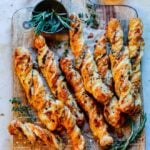 Cheesy Prosciutto Puff Pastry Twists | giveitsomethyme.com – Delicious, light and flaky puff pastry twisted with fontina, prosciutto, Dijon mustard and rosemary. Perfect for game day and holiday snacking!
