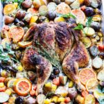 Sheet Pan Citrus Butter Spatchcock Chicken and Potatoes | giveitsomethyme.com – Delicious, tender and juicy chicken with crispy potatoes, Brussel sprouts and carrots round out this easy sheet pan meal perfect for any night of the week.