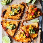 Crockpot Adobo Chicken Quesadillas | giveitsomethyme.com – Tender, juicy and perfectly spiced shredded chicken sandwiched between gooey cheese in crispy tortillas and topped with fresh Mango Salsa!