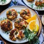 Seared crab cakes with crispy exterior and tender crab filled interior.