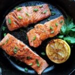 Caramelized salmon garnished with sliced green onion.