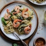 Shrimp scampi linguine served with wine on the side.